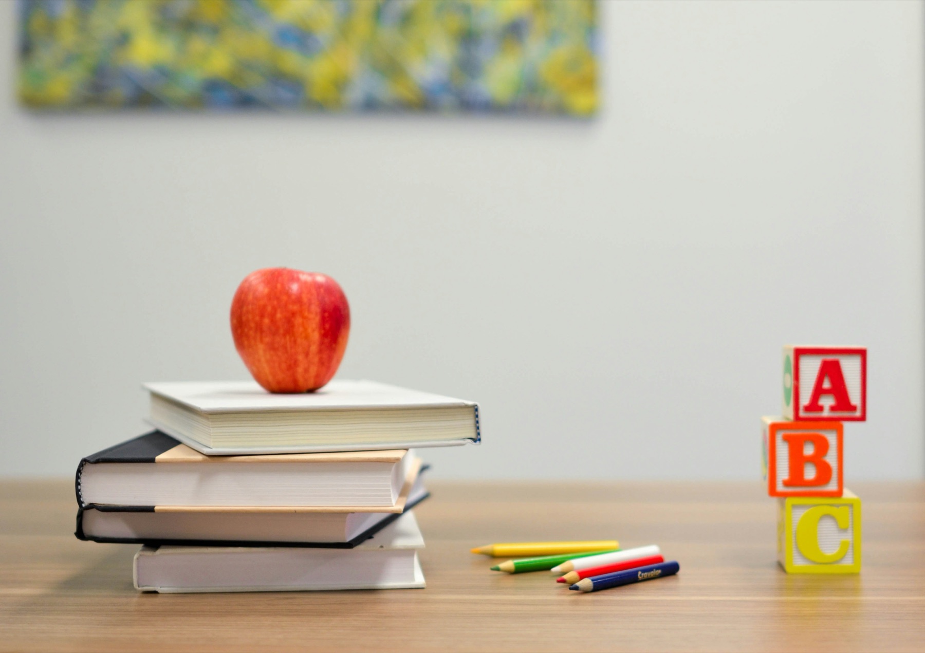School nutrition books and an apple arranged in a bright learning space